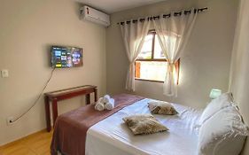 Casa aconchegante à 400m da Praia da Tartaruga - Ar condicionado - WIFI 450MB - Netflix - Cozinha Completa - Garagem